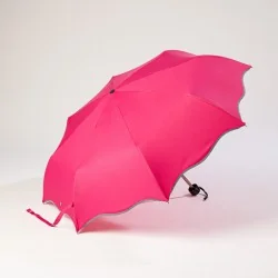 Mini pink umbrella with wave pattern, opens sideways