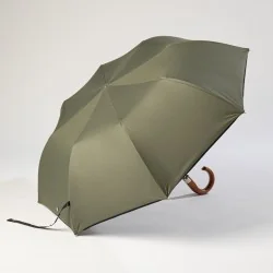 Khaki-coloured folding umbrella, opens sideways