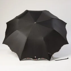 Black folding umbrella, open wave design