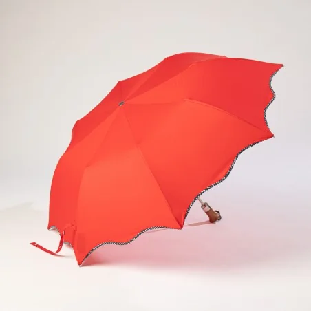 red polka dot folding umbrella, open sideways