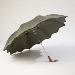 khaki folding umbrella with polka dots, open from the front