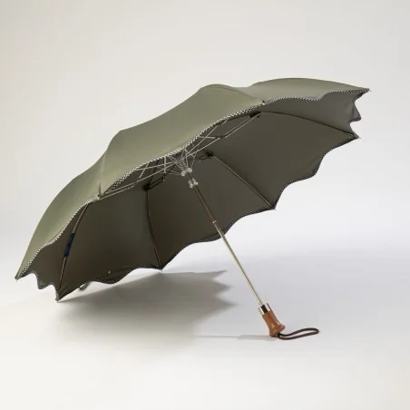 khaki folding umbrella with polka dots, open from the front