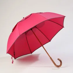 Pink umbrella with grey trim, front opening, anti-tilt feature