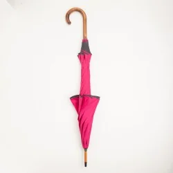 Pink umbrella with grey trim, closed