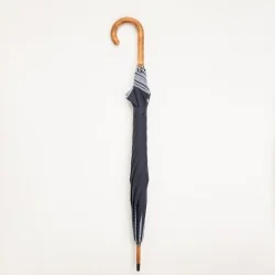 Navy blue umbrella with sailor stripes, closed