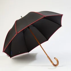 Black walking umbrella with red trim, front opening