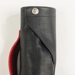 Black leather and pomodorro sheath for mini umbrella, closed