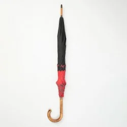 Black and red walking umbrella with Scottish knots, closed