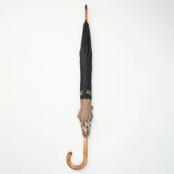 Black and camel walking umbrella with beige Scottish knots, closed