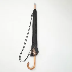 Black and camel walking umbrella with beige Scottish knots, in its cover