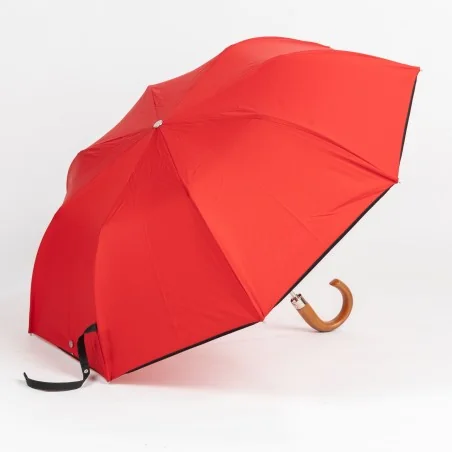 roter taschenschirm, seitlich geöffnet