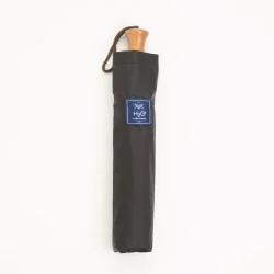 Grüner Deauville-Klappschirm in seiner Hülle