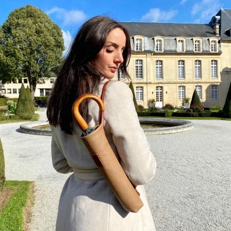 Folding umbrella in its desierto and whisky leather case
