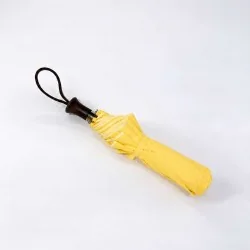 closed yellow folding umbrella