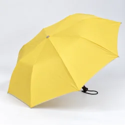yellow folding umbrella opened on the side