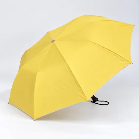 yellow folding umbrella opened on the side